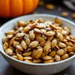 crispy roasted pumpkin seeds with sea salt - featured image